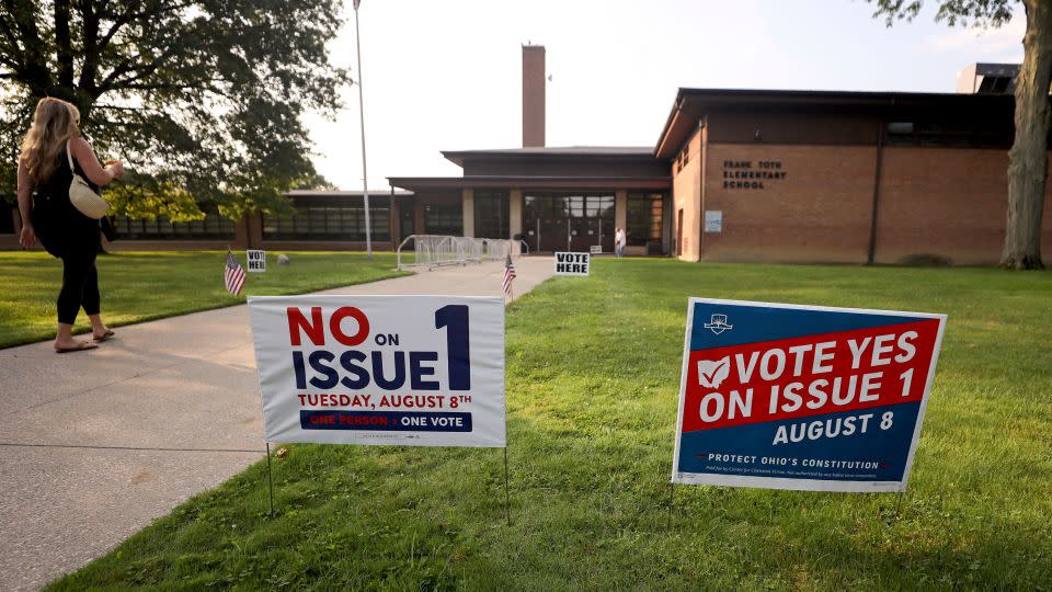 Opposing signs on the ballot measure are posted outside a polling site in Perrysburg, Ohio, on August 11, 2023.  - Kurt Steiss/AP