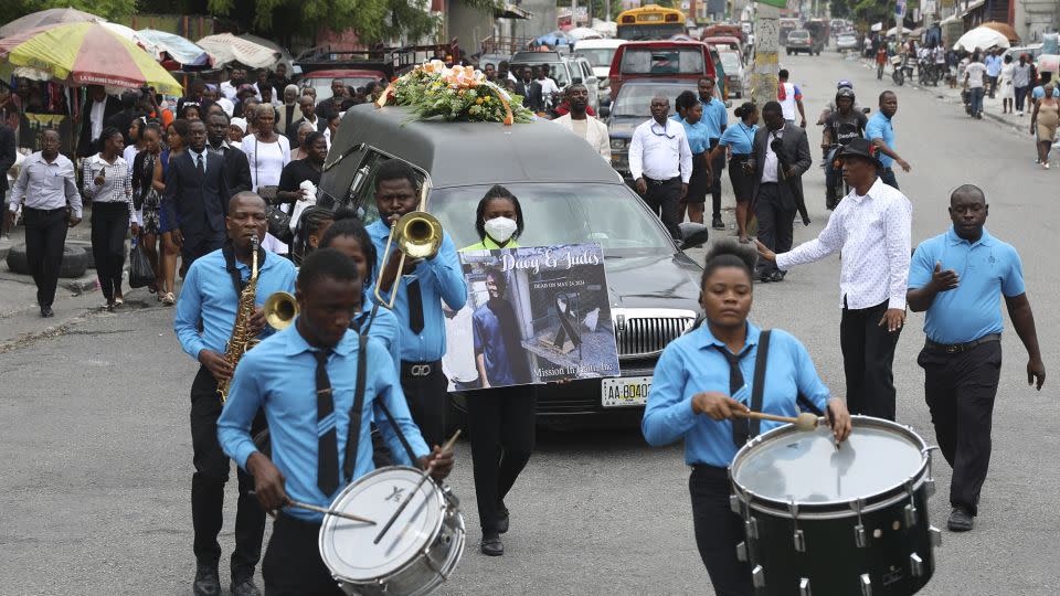 A funeral procession for mission director Judes Montis, killed by gangs alongside the two US missionary members, makes its way to the cemetery after his funeral ceremony in Port-au-Prince on Tuesday. - Odelyn Joseph/AP