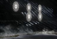 Giant snowflakes are seen during the opening ceremony of the 2014 Sochi Winter Olympics, February 7, 2014. REUTERS/Mark Blinch