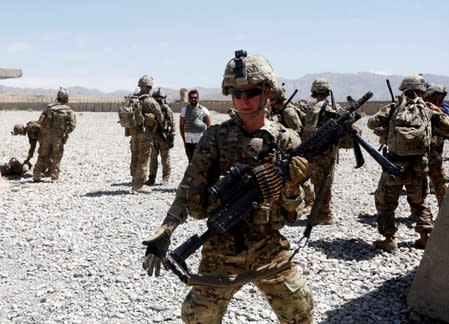 FILE PHOTO: U.S. troops wait for their helicopter flight at an Afghan National Army (ANA) Base in Logar province, Afghanistan