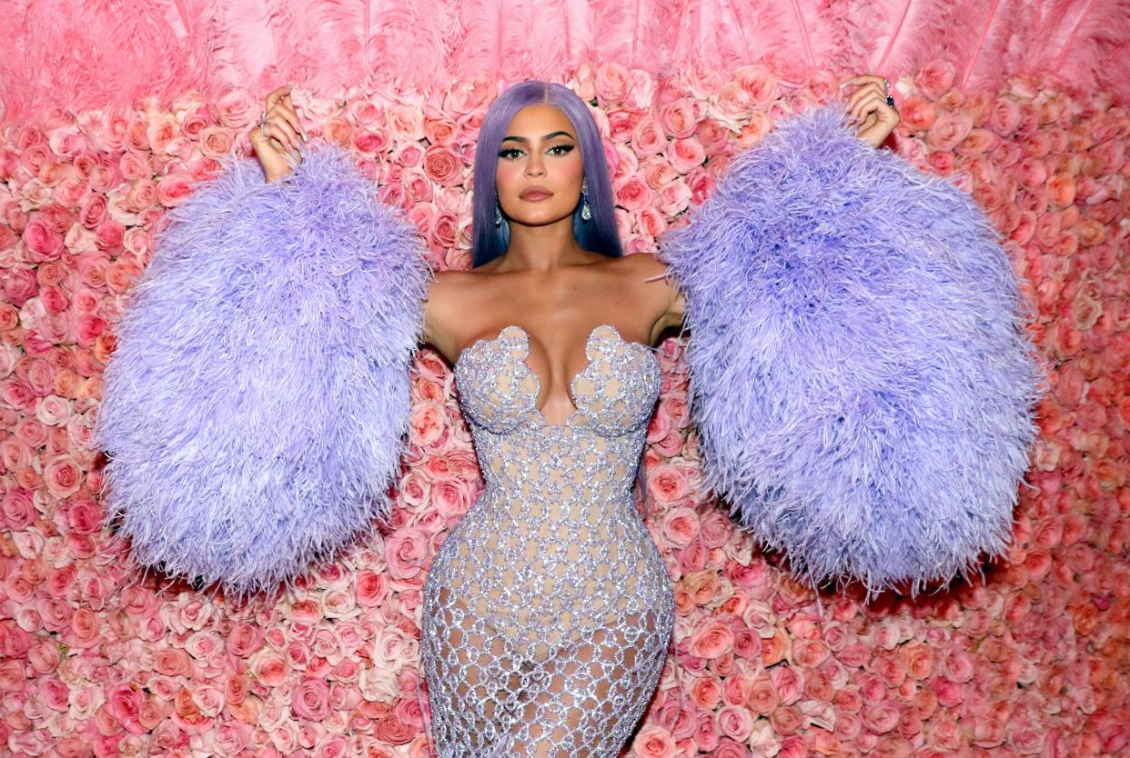 Kylie Jenner poses at the MET gala wearing a purple bodysuit