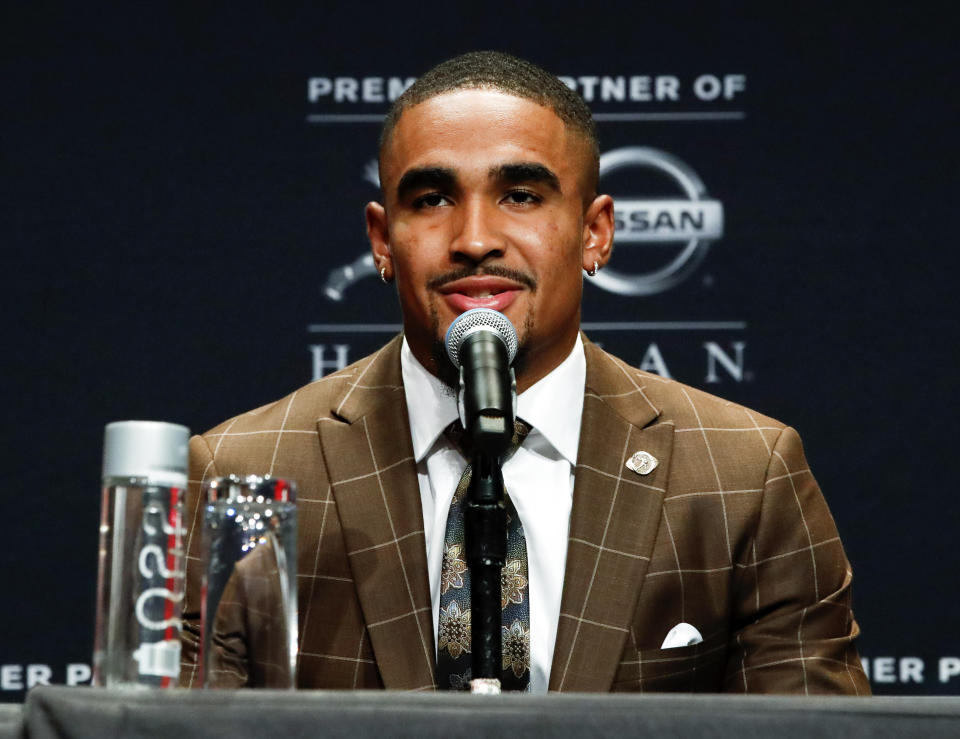 NCAA college football player and Heisman Trophy finalist, Oklahoma quarterback Jalen Hurts talks to the media during a news conference before the start of the Heisman Trophy ceremony, Saturday, Dec. 14, 2019, in New York. (AP Photo/Jason Szenes)