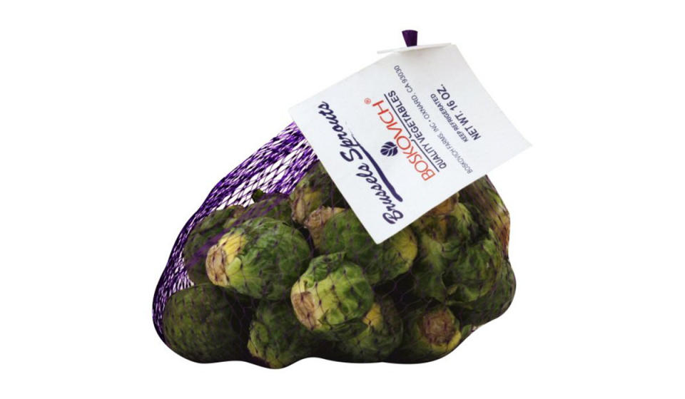 Bundle of fresh Brussels sprouts in a mesh bag.