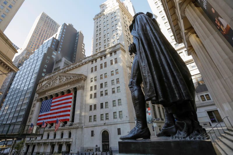 FILE PHOTO: The statue of former U.S. President George Washington stands across from the New York Stock Exchange (NYSE) in Manhattan
