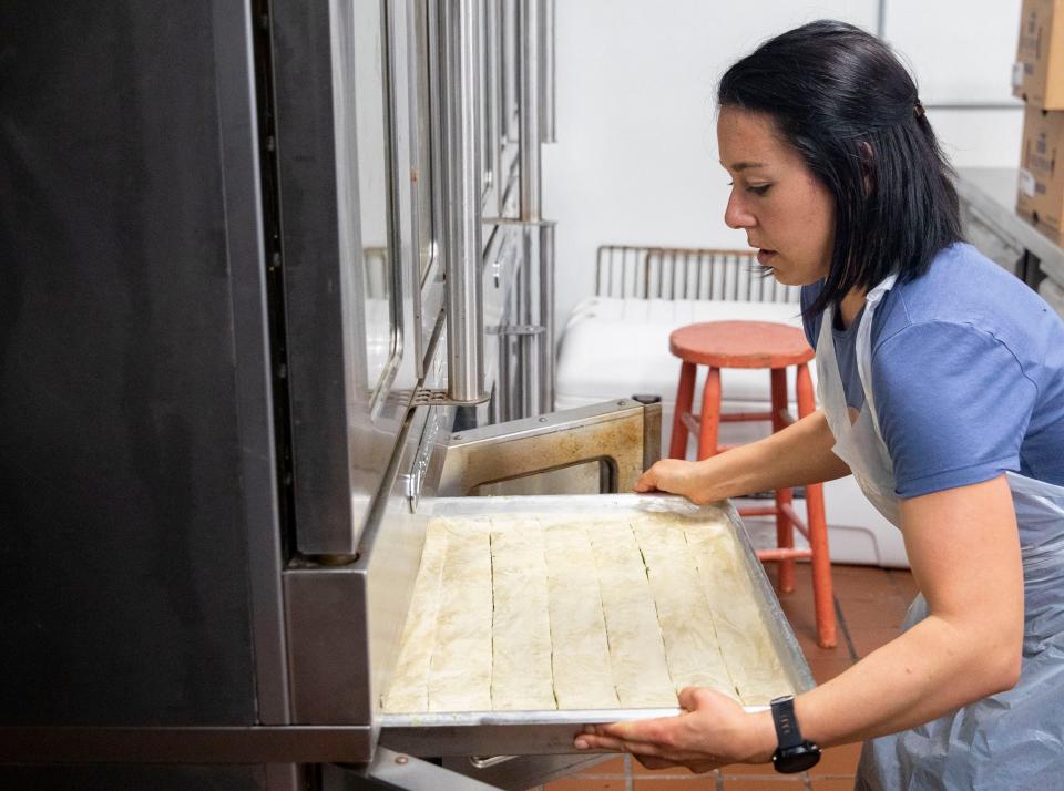 Madeleine Donnelly puts spanakopita in the oven for the Memphis Greek Festival on Saturday, March, 2022, at at Annunciation Greek Orthodox Church in Memphis. The festival runs May 20-21, but food preparation began in January. 