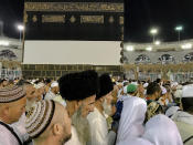 Muslim pilgrims circle around the Kaaba, the cubic building at the Grand Mosque, ahead of the annual Hajj pilgrimage, in the Muslim holy city of Mecca, Saudi Arabia, Friday, Aug. 17, 2018. The annual Islamic pilgrimage draws millions of visitors each year, making it the largest yearly gathering of people in the world. (AP Photo/Dar Yasin)