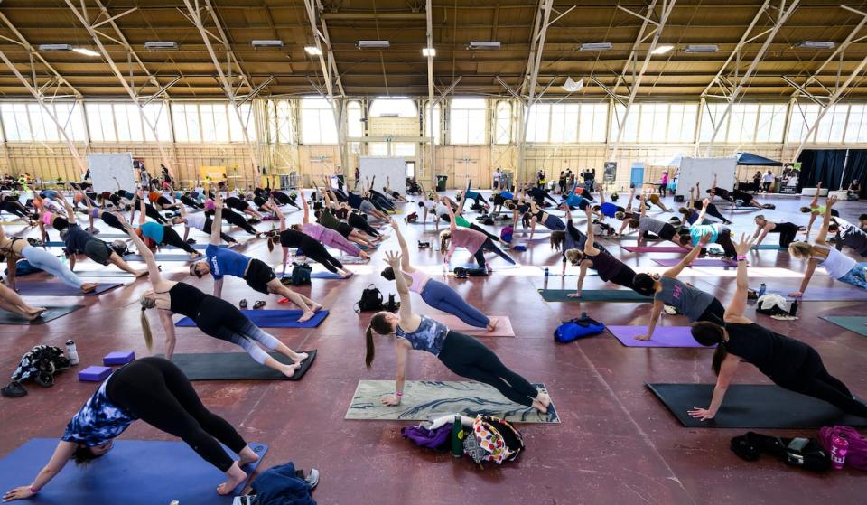 A session during City of Om, a yoga and wellness festival in Ottawa's Lansdowne Park, on June 3, 2023.