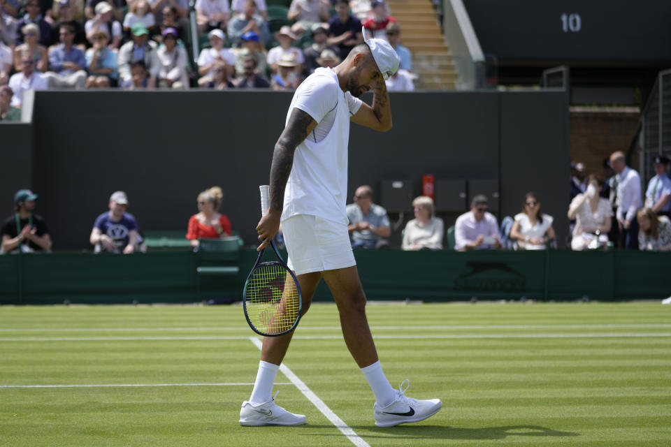 Australia's Nick Kyrgios looks down after losing a point during the singles tennis match against Britain's Paul Jubb on day two of the Wimbledon tennis championships in London, Tuesday, June 28, 2022. (AP Photo/Kirsty Wigglesworth)