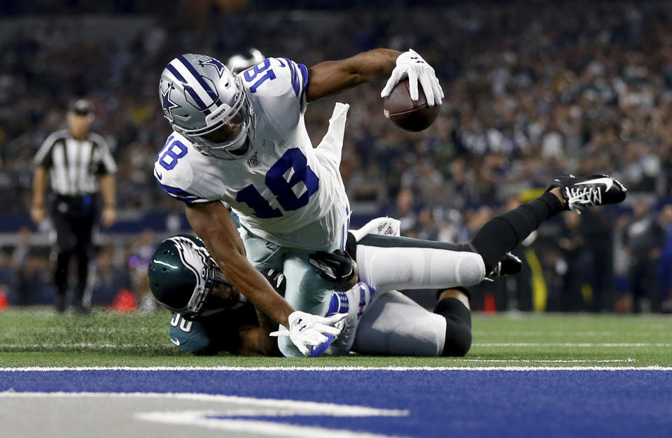 Dallas Cowboys wide receiver Randall Cobb (18) is stopped shy of the end zone after catching a pass by Philadelphia Eagles running back Boston Scott (38) in the first half of an NFL football game in Arlington, Texas, Sunday, Oct. 20, 2019. (AP Photo/Ron Jenkins)