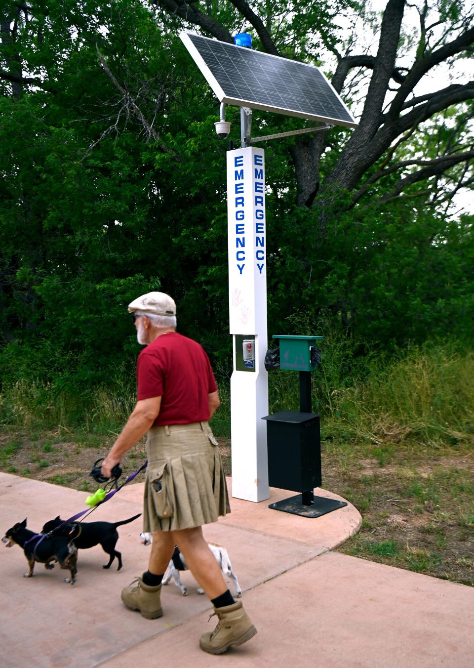 One of the solar-powered emergency contact stations located along the Cedar Creek Waterway April 27. Police officers riding bicycles were also seen on the trail Saturday.