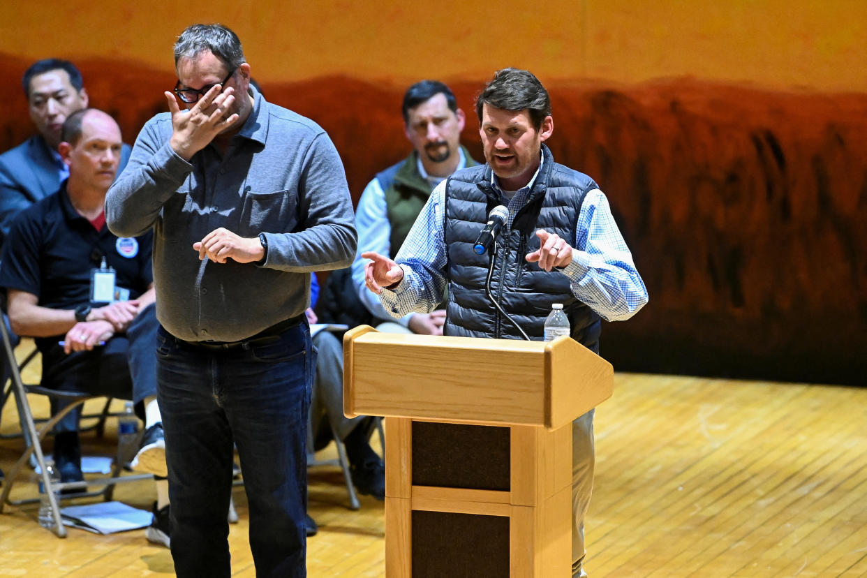 Darrell Wilson, assistant vice president government relations of Norfolk Southern, the company that owns the train involved in the derailment that spilled toxic chemicals, speaks during a town hall held by the U.S. Environmental Protection Agency (EPA), in East Palestine, Ohio, U.S., March 2, 2023.  REUTERS/Alan Freed