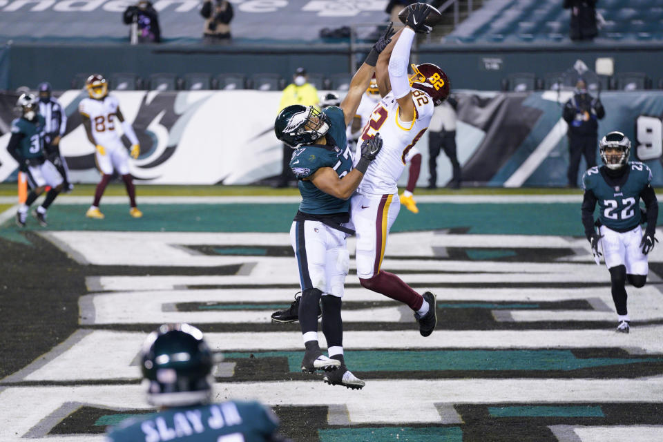 Washington Football Team's Logan Thomas (82) catches a touchdown against Philadelphia Eagles' T.J. Edwards (57) during the first half of an NFL football game, Sunday, Jan. 3, 2021, in Philadelphia. (AP Photo/Chris Szagola)