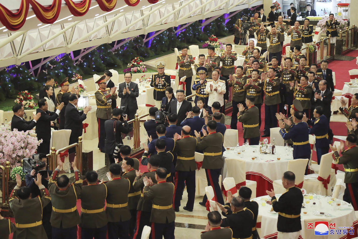 In this photo provided by the North Korean government, North Korean leader Kim Jong Un, center, with his wife Ri Sol Ju, center left, and his daughter, center right, participate in a feast to mark the 75th founding anniversary of the Korean People’s Army at an unspecified place in North Korea Tuesday, Feb. 7, 2023. Independent journalists were not given access to cover the event depicted in this image distributed by the North Korean government. The content of this image is as provided and cannot be independently verified. Korean language watermark on image as provided by source reads: "KCNA" which is the abbreviation for Korean Central News Agency. (Korean Central News Agency/Korea News Service via AP)