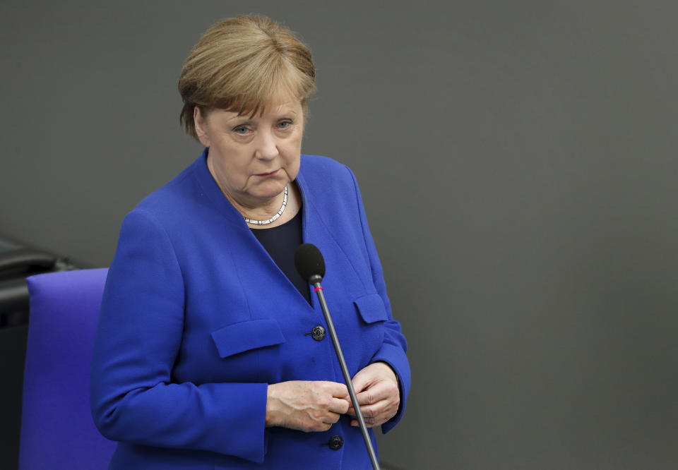 German Chancellor Angela Merkel takes questions as part of a meeting of the German federal parliament, Bundestag, at the Reichstag building in Berlin, Germany, Wednesday, May 13, 2020. (AP Photo/Michael Sohn)