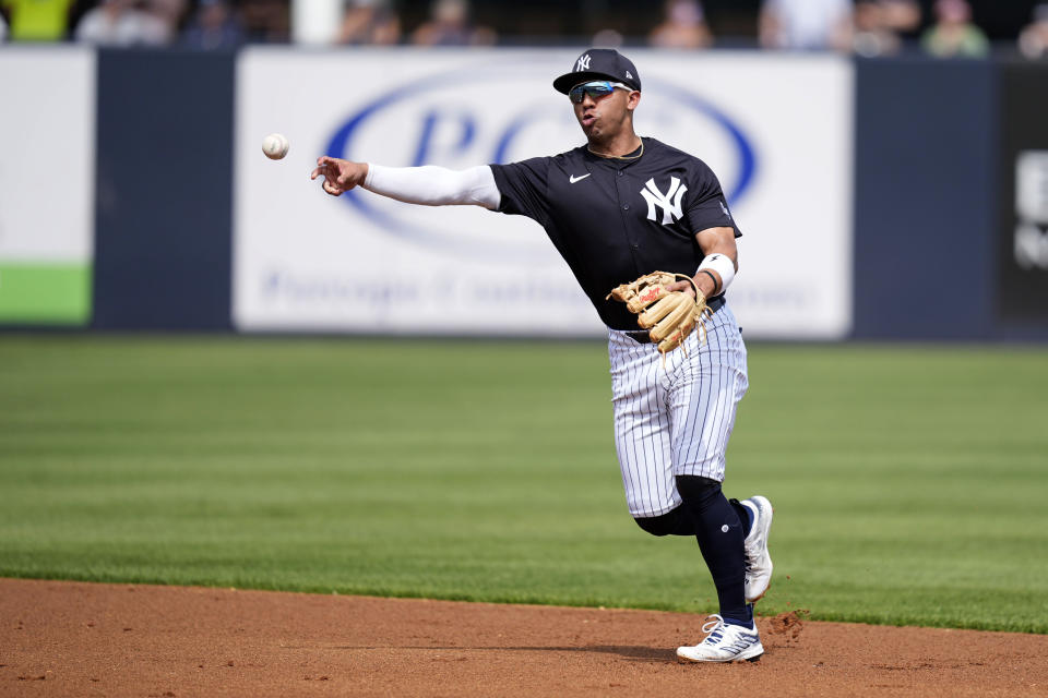 New York Yankees shortstop Oswald Peraza throws to first base during the first inning of a spring training baseball game against the Tampa Bay Rays Wednesday, March 6, 2024, in Tampa, Fla. (AP Photo/Charlie Neibergall)