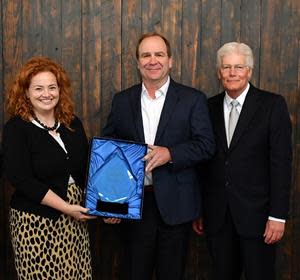 IMA President and CEO Brian Burton (right) presents the Innovation Excellence Award to Wabash National Corporation’s General Counsel & CHRO Kristin Glazner and SVP – Customer Value Creation Kevin Page on October 14, 2021.