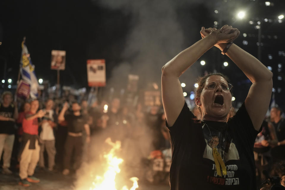 A woman takes part in a protest against Israeli Prime Minister Benjamin Netanyahu's government and call for the release of hostages held in the Gaza Strip by the Hamas militant group, in Tel Aviv, Israel, Saturday, March 30, 2024. (AP Photo/Maya Alleruzzo)