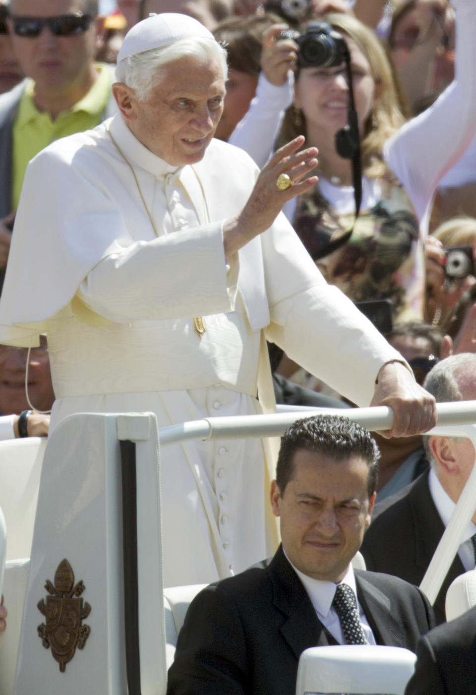 FILE - Pope Benedict XVI, flanked by his butler Paolo Gabiele, delivers his blessing as he arrives at St. Peter's square at the Vatican for a general audience, on Wednesday, May, 23, 2012. When Cardinal Joseph Ratzinger became Pope Benedict XVI and was thrust into the footsteps of his beloved and charismatic predecessor, he said he felt a guillotine had come down on him. The Vatican announced Saturday Dec. 31, 2022 that Benedict, the former Joseph Ratzinger, had died at age 95. (AP Photo/Andrew Medichini, File)