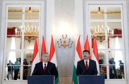 Hungarian President Janos Ader and Hungarian Prime Minister Viktor Orban give a statement to the media after their talks at the Presidential Palace in Budapest, Hungary, May 7, 2018. REUTERS/Bernadett Szabo