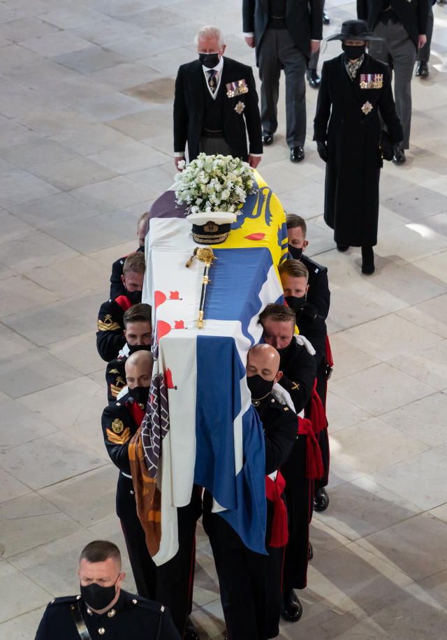 Pall Bearers carrying the coffin of the Duke of Edinburgh, followed by the Prince of Wales (left), Princess Anne (right) in St George&#39;s Chapel, Windsor Castle, Berkshire. Picture date: Saturday April 17, 2021.