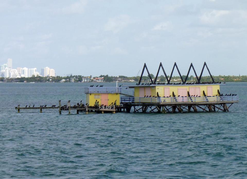 In this photo taken Sunday, Nov. 11, 2012, shows one of the seven Stiltsville homes near Miami, Fla. The narrated tour tells the colorful story of these homes perched above the shallow waters of Biscayne Bay. (AP Photo/Suzette Laboy)