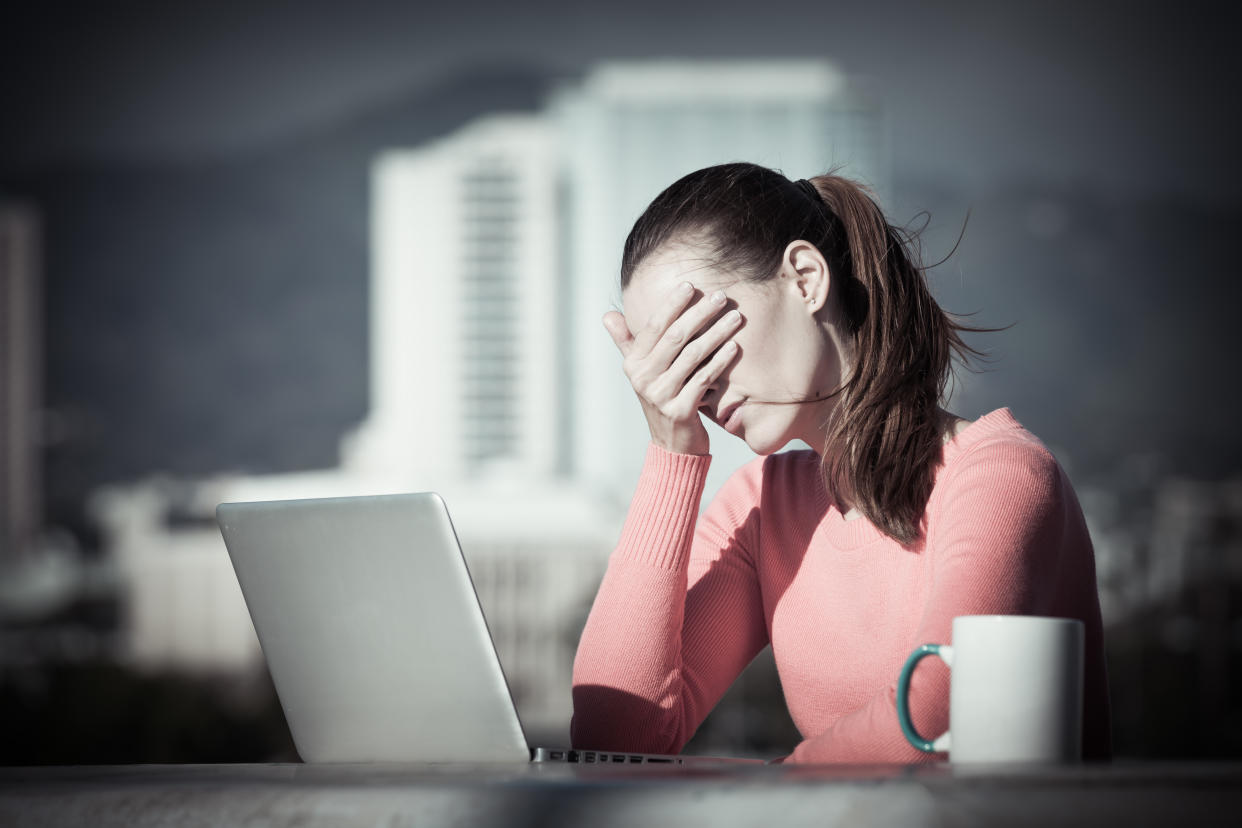 Stressed out businesswoman on her computer.  