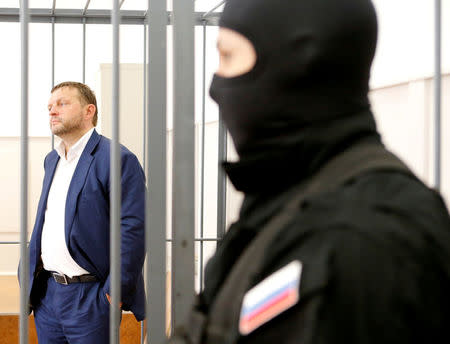 Governor of Kirov region Nikita Belykh, who is accused by the Investigative Committee of taking a bribe, stands inside a defendants' cage during a hearing at the Basmanny district court in Moscow, Russia, June 25, 2016. REUTERS/Maxim Zmeyev/File Photo