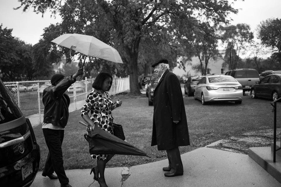 <p>Spencer Leak Sr greets attendees at a funeral he helped organize on Chicago’s south side. (Photo: Jon Lowenstein/NOOR for Yahoo News) </p>