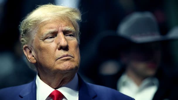 PHOTO: Former President Donald Trump stands on the floor during the Division I Mens Wrestling Championship, March 18, 2023 in Tulsa, Okla. (Shane Bevel/NCAA Photos via Getty Images)