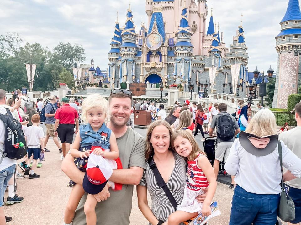 family in front of Magic Kingdom Orlando Florida