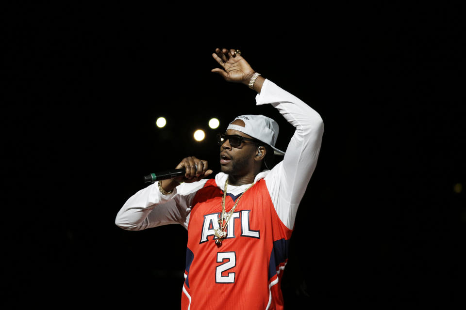 Rap artist 2 Chainz performs before the start of an NBA basketball game between the Atlanta Hawks and the Miami Heat Friday, March 27, 2015, in Atlanta. (AP Photo/David Goldman)