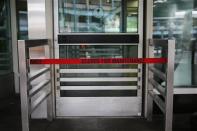 The entrance to a door for baggage claims is blocked at the central terminal of LaGuardia Airport in the Queens borough of New York April 8, 2014. REUTERS/Shannon Stapleton