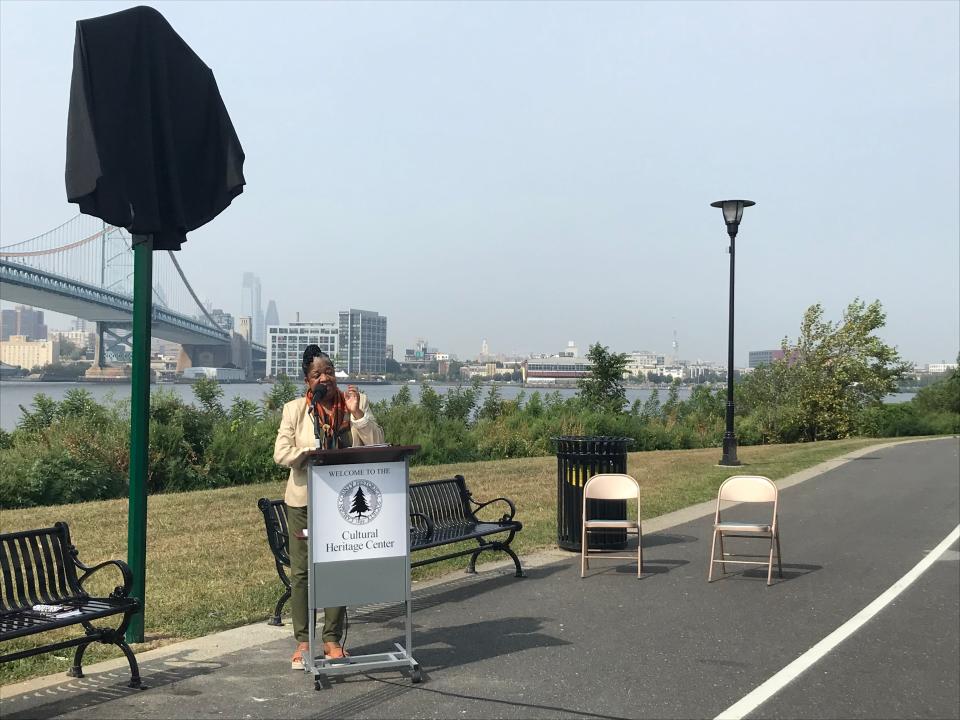 Poet Sandra Turner-Barnes reads one of her works at an unveiling ceremony for a marker commemorating a site where slaves were once bought and sold along the Camden Waterfront in September 2020.