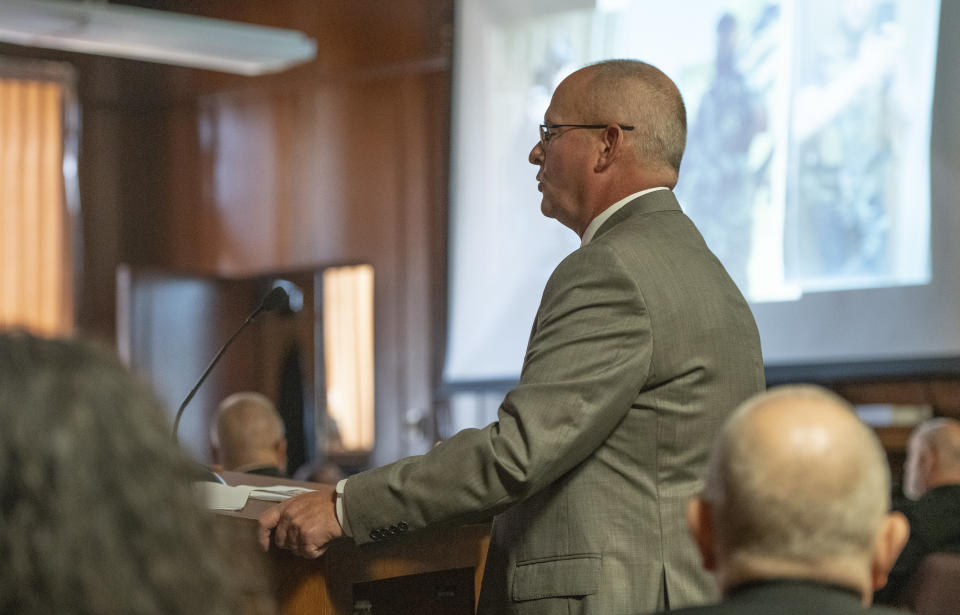 Michigan Assistant Attorney General William Rollstin makes his opening statement in the trial for Paul Bellar, Joseph Morrison and Pete Musico before Jackson County Circuit Court Judge Thomas Wilson on Wednesday, Oct. 5, 2022 in Jackson, Mich. Bellar, Morrison and Musico are charged in connection with a 2020 anti-government plot to kidnap Michigan Gov. Gretchen Whitmer. (J. Scott Park/Jackson Citizen Patriot via AP, Pool)