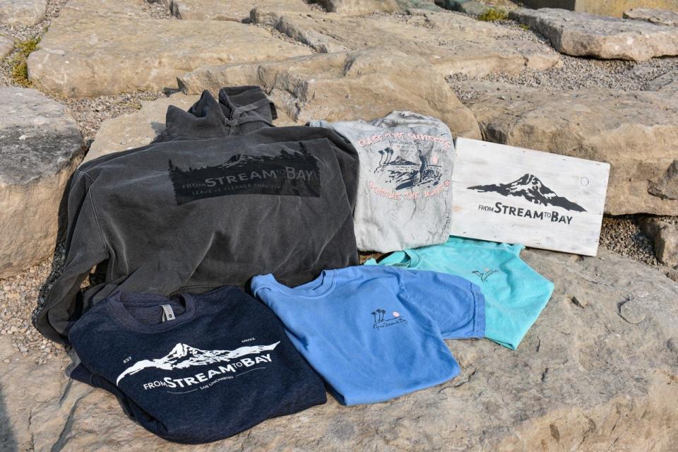 Alec Ochs designs all of the eco-friendly apparel for his company, From Stream to Bay.