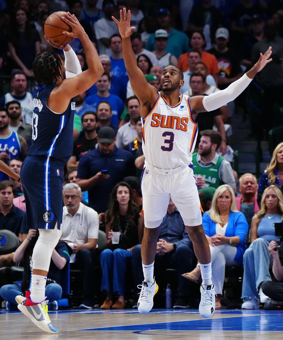 May 12, 2022; Dallas, Texas; USA; Suns guard Chris Paul (3) contests a shot from Mavericks Jalen Brunson (13) during game 6 of the second round of the Western Conference Playoffs.