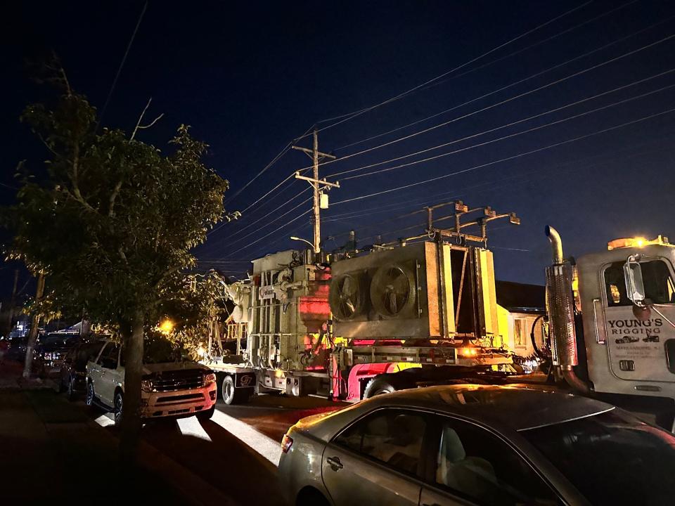 A flatbed truck brings electrical power equipment Friday night to the Atlantic City Electric substation of Lake Avenue after a fire at its control building caused a power outage to 24,000 customers  on the Wildwoods' barrier island at the Jersey Shore