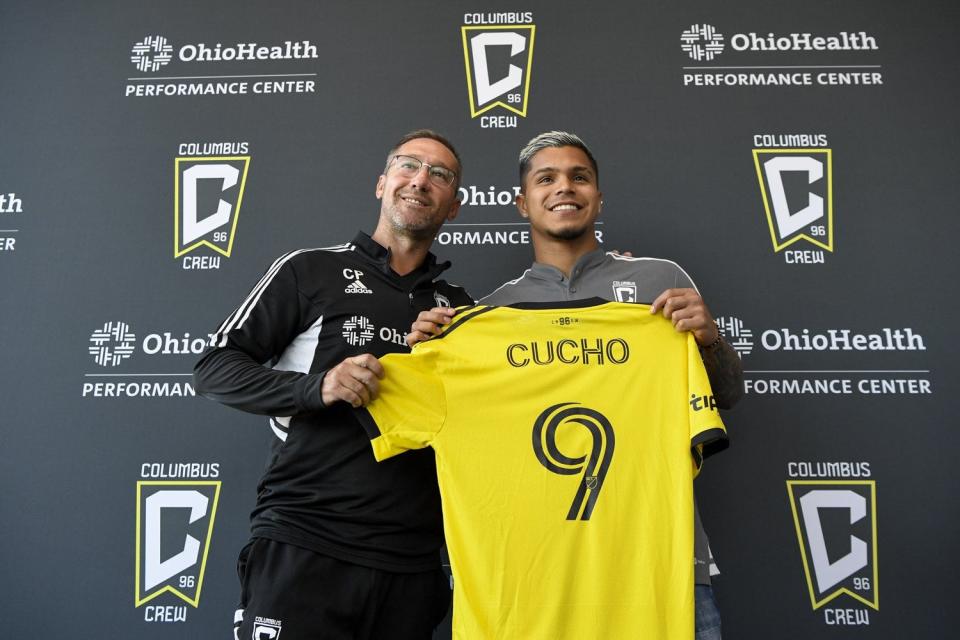 Crew Head Coach Caleb Porter, left, poses with new Crew player Cucho Hernandez.