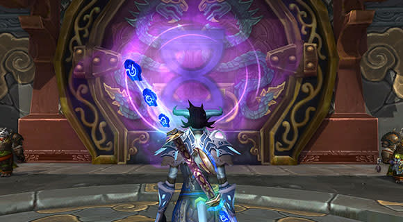 A draenei mage stands in front of the entrance to a Challenge Mode.