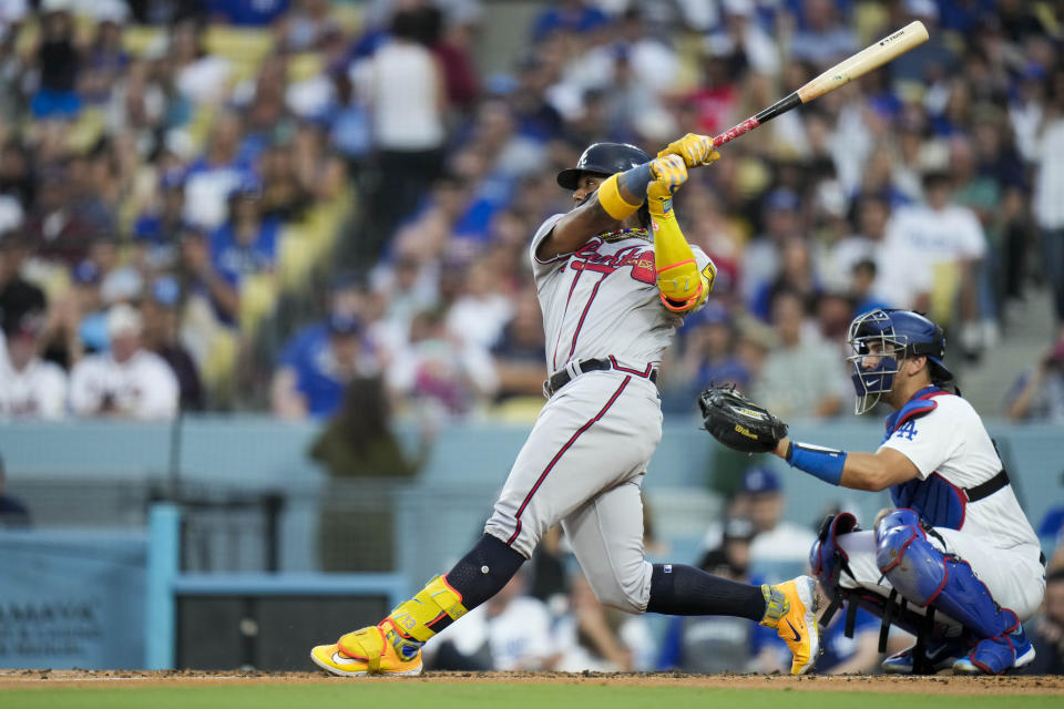 Atlanta Braves' Ronald Acuña Jr. follows through on a home run against the Los Angeles Dodgers during the third inning of a baseball game Saturday, Sept. 2, 2023, in Los Angeles. (AP Photo/Jae C. Hong)