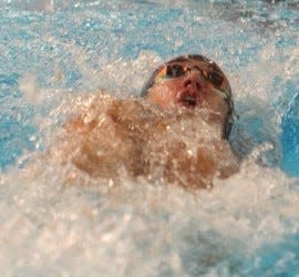 BNL junior Cole Baker glides to victory in the 100 backstroke in the season opener against Edgewood.