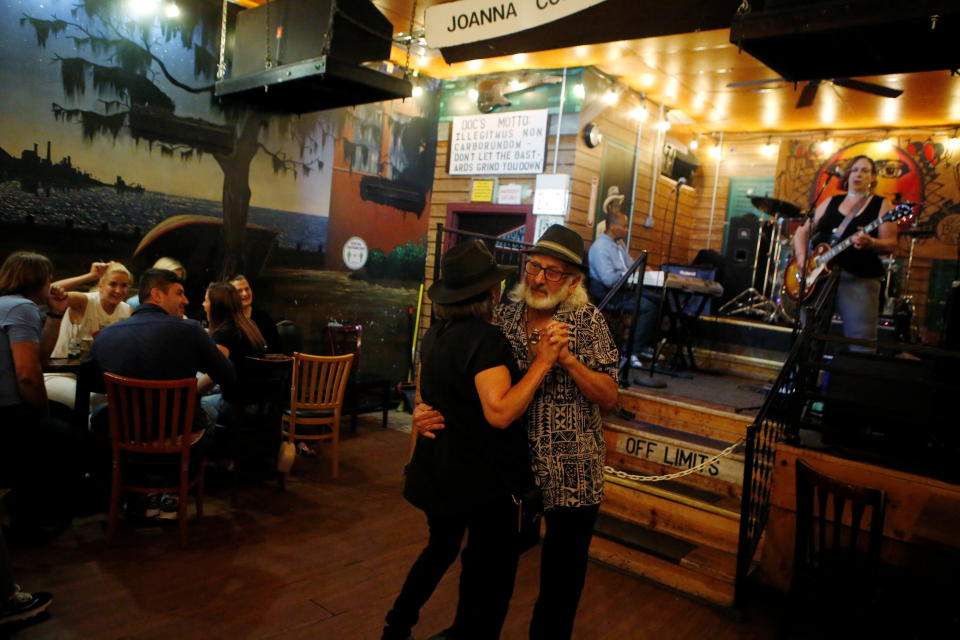 Pamela and Tom Pickens of Madison, Indiana, enjoy live music as coronavirus disease (COVID-19) restrictions are eased at blues bar Kingston Mines in Chicago, Illinois, U.S., June 24, 2021. Picture taken June 24, 2021.   REUTERS/Eileen T. Meslar