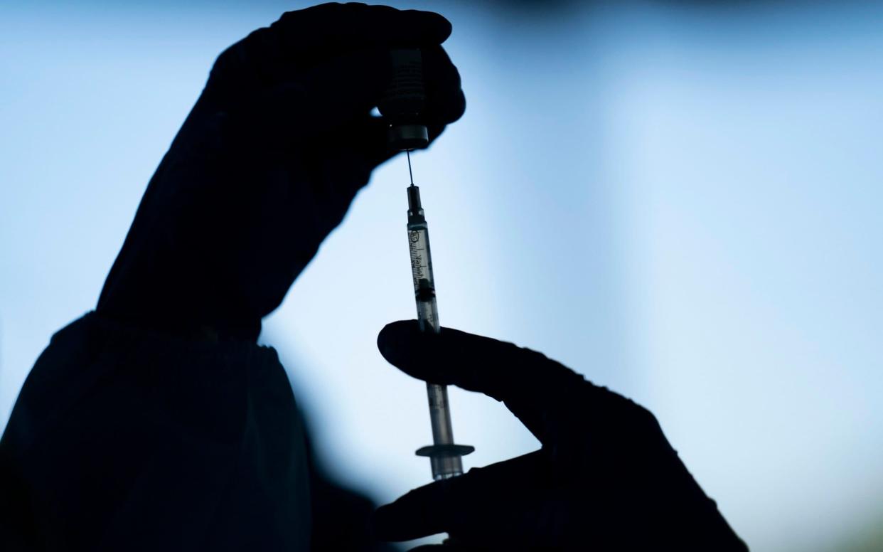 FILE - In this Jan. 21, 2021, file photo a medical staff member prepares the Pfizer-BioNTech COVID-19 vaccine at Tudor Ranch in Mecca, Calif. Health insurance giant Blue Shield of California will be the outside administrator tasked with ramping up the state's coronavirus vaccine delivery system, which to date has been slow, stilted and plagued by confusion, the state health agency said in a statement Wednesday, Jan. 27, 2021. (AP Photo/Jae C. Hong, File) -  Jae C. Hong/AP