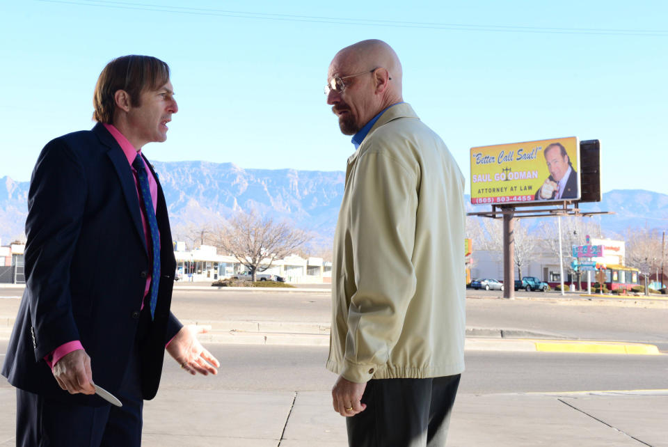 two man talking in a parking lot