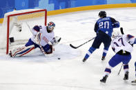FILE - Eeli Tolvanen (20), of Finland, scores a goal against goalie Lars Haugen (30), of Norway, during the second period of the preliminary round of the men's hockey game at the 2018 Winter Olympics in Gangneung, South Korea, Friday, Feb. 16, 2018. The 2018 Olympics without NHL talent offered a glimpse of things to come for players who hadn't yet reached the best hockey league in the world. (AP Photo/Frank Franklin II, File)