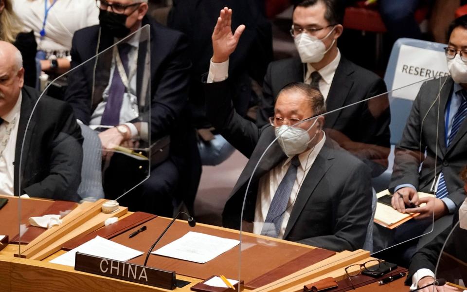  China's UN Ambassador Zhang Jun votes to abstain, in the United Nations Security Counci - AP