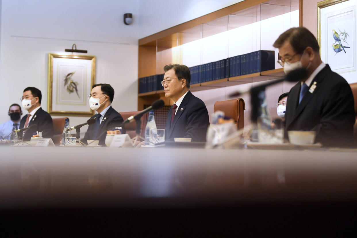 South Korean President Moon Jae-in, second right, speaks during a bilateral meeting with Australian Prime Minister Scott Morrison at Parliament House, Canberra, Monday, Dec. 13, 2021. Moon is on a two-day official visit to Australia. (Lukas Coch/Pool Photo via AP)