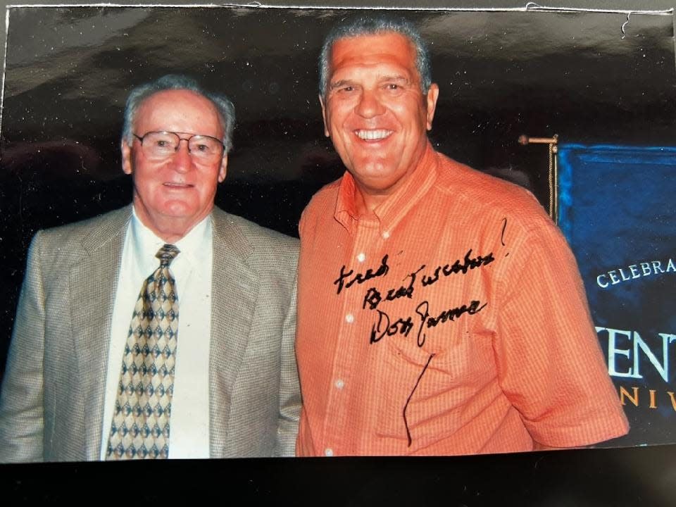 Former Kent State football coach Don James (left) poses for an undated photo with one of his first Golden Flashes' team captains, Fred Blosser.