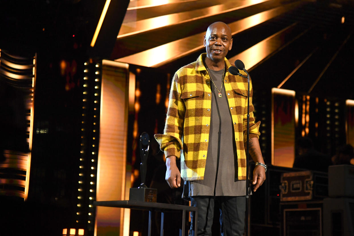 CLEVELAND, OHIO - OCTOBER 30: Dave Chappelle speaks onstage during the 36th Annual Rock & Roll Hall Of Fame Induction Ceremony at Rocket Mortgage Fieldhouse on October 30, 2021 in Cleveland, Ohio. (Photo by Kevin Mazur/Getty Images for The Rock and Roll Hall of Fame )