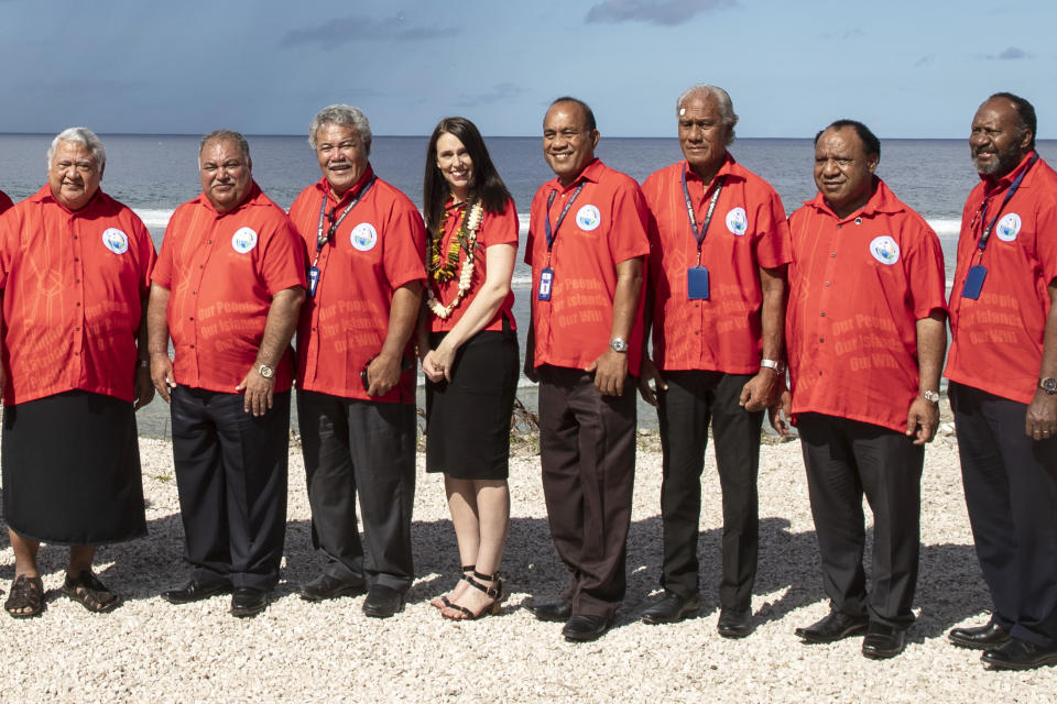 Nauru President Baron Waqa, second from left, poses with New Zealand Prime Minister Jacinda Ardern, fourth from left and other Pacific leaders for a group photo during the Pacific Islands Forum in Nauru, Wednesday, Sept. 5, 2018. (Jason Oxenham/Pool Photo via AP)